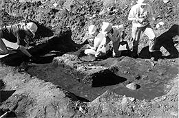 Digging Feature 7, a privy at the rear of 26 1st Street North